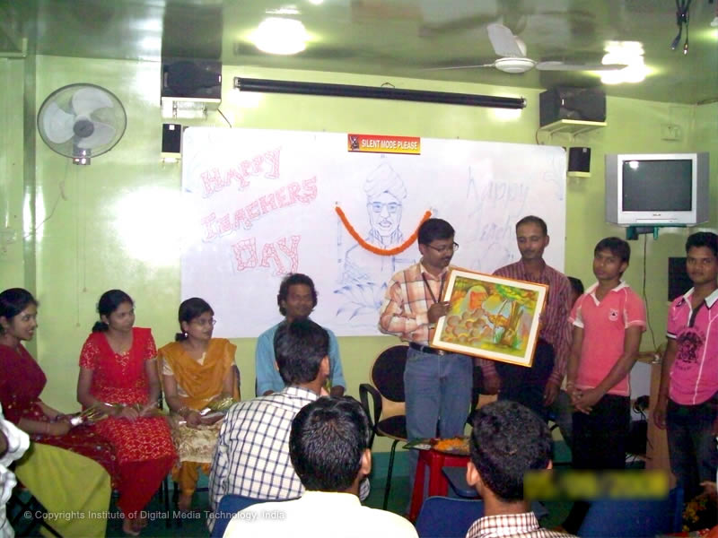 Students presenting a handmade painting with lots of love to their honorable teachers, on the occasion of Teacher’s Day celebration at IDMT.